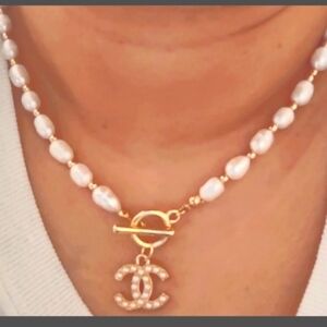 Pearl Chanel pendant necklace , brand new .